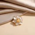 Elegant flower brooch with enamel petals, golden pearl and sparkling zircon accents. - White