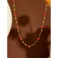 Gold stainless steel necklace featuring sparkling red crystal heart beads and chic square accents. - Red Bead Square Necklace / Gold