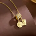 Minimalist gold tone zircon pendant necklace with engraved round tag for women chic jewelry - Airplane Passport Style (T2331)