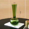 Modern green glass vase with long neck and round body, ideal for living room decoration. - S / Green