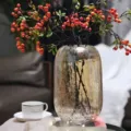 Detailed view of large glass crackle vase with floral arrangement for chic home decor styling. - L / Amber