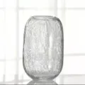 Detail view of large crackle glass vase for flowers, clear textured home decor accent. - L / Clear