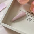 Detailed close-up view of pink fabric BB hair clip, ideal for fringe and daily styling. - Triangle Style / Light Pink