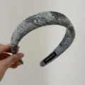 Detailed view of vintage blue fabric padded headband with abstract pattern, handmade craft. - Blue Floral Headband