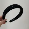 Detail view of black polka dot fabric headband, elegant hair hoop accessory for women. - Black Polka Dot Headband