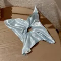 Light blue satin hair scrunchie with square scarf tail, smooth texture detail shot. - Ice Blue