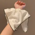 White ruffled fabric wrist cuff with black lace trim and cute bow button detail accessory. - Square Scarf Ribbon Style / White