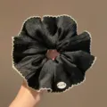 Black satin scrunchie with white lace ruffle edge, elegant hair tie for women daily use. - Classic Scrunchie Style / Black