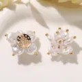 Detailed view of pearl crystal camellia DIY flower charm, brooch and earring accessory. - Flower