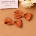 Bonitas pinzas para el pelo con lazo de tela marrón caramelo, ideales para estilo y accesorios DIY. - S / Naranja