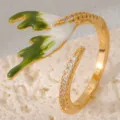 Gold open ring featuring green and white enamel deer antler design with sparkling synthetic zirconia. - Green