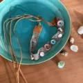 Detailed view of bohemian ethnic braided rope accessory with buttons and shells for styling. - Style I