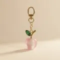 Elegant pink apple keychain with gold chain and green crystal leaf charm for women bags. - Pink