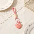 Cute pink heart keychain bag charm with bell and sweet love graphic for women and girls. - Pink