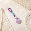 Adorable purple heart keychain with cute charm and strap for stylish bag accessory. - Purple