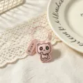 Detail closeup of cute pink leather cat keychain with motivational tag for student gift. - Pink (Wei Lai Ke Qi)