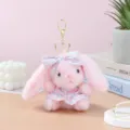 Cute pink plush rabbit keychain with checkered dress and bow, perfect bag pendant gift. - Pink