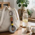 Grip strength trainer keychain bag charm, portable hand exerciser 50LB, light grey color - Gray
