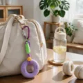Fitness grip strength trainer keychain and bag charm with 40LB and 30LB resistance levels. - Purple