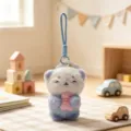 Cute plush otter keychain holding a small fish, soft stuffed animal bag charm for keys. - Blue