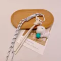 Cute plush animal bag charm keychain with woven rope and bell pendant for stylish bags - White