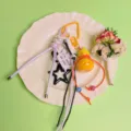 Cute gourd keychain charm set with woven lanyard and star pendant for stylish bag decoration. - Orange