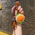 Cute plush burger keychain bag charm with woven lanyard, soft cartoon food keyring pendant. - Hamburger