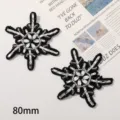 Detail shot of black and white beaded snowflake patch, exquisite DIY craft accessory 80mm. - Snowflake Style / Black and White