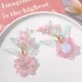 Detailed close-up of handmade crystal flower hair accessory DIY material, pink petals. - Pink Dark Green Leaf Shaped Flower