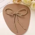 Pearl bow DIY handmade accessory, delicate detail shot for shoes, bags and jewelry crafting. - Brown