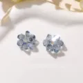Close-up of sparkling blue crystal flower detail, perfect DIY accessory for elegant jewelry. - Grey Blue