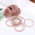 Pack of pink elastic hair ties for women and girls, minimalist soft hair bands daily styling. - 100 Pieces/Pack / Light Pink