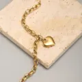 Bracciale catena paperclip in acciaio inossidabile dorato con ciondolo cuore. - Oro