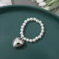 White pearl beaded bracelet with metallic silver heart pendant elegant fashion jewelry accessory - 6mm Medium Puffy Heart (1 Piece)