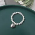 White imitation pearl beaded bracelet with silver heart pendant for charming everyday wear style. - 6mm Small Puffy Heart Bead (1 Piece)