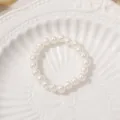 Elegant white faux pearl bracelet, classic beaded elastic wrist jewelry for women daily wear. - 6mm Pearl Ring (1 Piece)