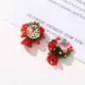 Close-up of Christmas red beaded flower cluster earrings detail, festive handmade DIY accessory. - Flower