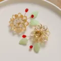 Handmade crystal lotus flower hair accessory detail view, DIY beading material components. - Orange