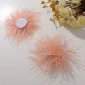 Pink ostrich feather flower DIY hair accessory detail, fluffy petal texture for handmade crafts. - Light Orange