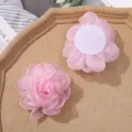 Close up of pink organza burnt edge mesh flower DIY handmade hair accessory material. - Pink
