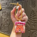 Llavero de capibara lindo con diseño de burbujas, juguete antiestrés creativo para bolsos. - Carpincho que sopla burbujas - Tostada