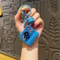 Llavero luminoso con forma de cámara azul y motivo de astronauta, lindo colgante para bolso. - Cámara instantánea de juguete luminosa - Astronauta