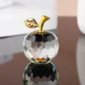 Exquisite crystal apple figurine detail featuring a gold stem and sparkling rhinestones. - Clear