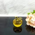 Crystal apple ornament with golden stem and sparkling rhinestones for home decor detail. - Yellow