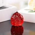 Red glass walnut sculpture detail shot, exquisite carved texture, elegant decorative ornament. - 45mm Walnuts / Red