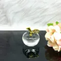 Crystal apple figurine detail shot, transparent glass ornament with rhinestone gold stem. - Clear