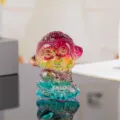 Close-up detail of a colorful crystal monkey figurine holding a peach, stunning glass ornament. - 5cm Height / Colorful