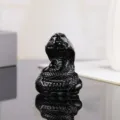 Detailed view of black crystal snake ornament, Chinese zodiac animal figurine for home decor. - Black