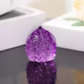 Purple glass walnut ornament close-up, smooth and translucent handheld art piece detail view. - 45mm Walnuts / Purple