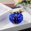 Blue crystal pumpkin ornament detail, gold branch top, elegant desktop decor display. - Blue